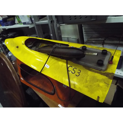 9 - model fuel Engine powerboat 32 inches long with carry cradle. Working condition unknown.