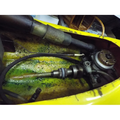 9 - model fuel Engine powerboat 32 inches long with carry cradle. Working condition unknown.