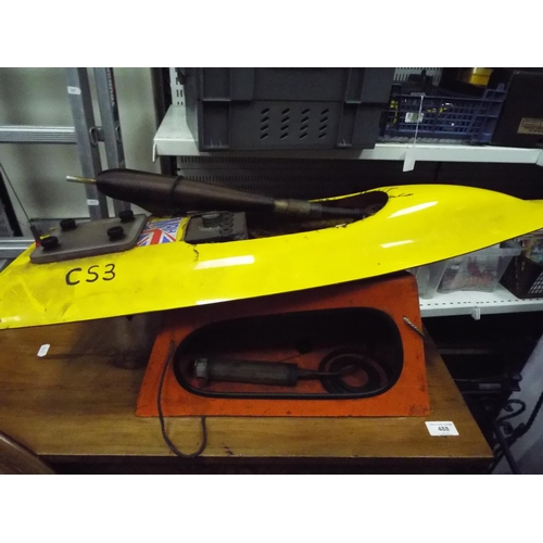 9 - model fuel Engine powerboat 32 inches long with carry cradle. Working condition unknown.