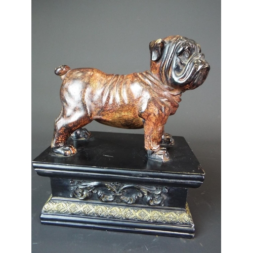 28 - Matched pair of Ceramic bulldogs mounted on ebonised and decorated wooden plinth bases. Each measure... 