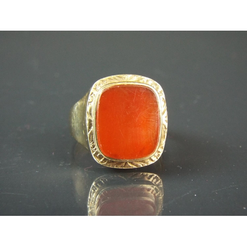 43 - Large 9ct Yellow Gold mens signet ring set with a Square Cornelian. Finger size 'X'  8.3g overall.