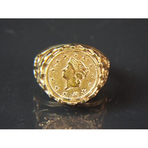 62 - 9ct Yellow gold ring set with a one Tallar coin. Finger size 'I-5'  3.1g