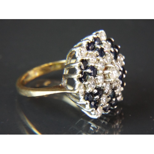 64 - 9ct Gold, Black and white CZ set ring ring. Finger size 'N-5'   6.3g