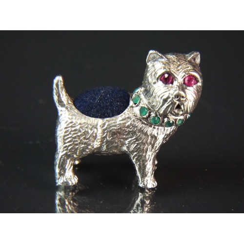 80 - 925 Silver pincushion as a small West Highland Terrier which has Emerald coloured stones to it's col... 