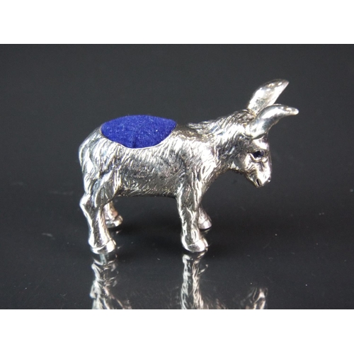 81 - Lovely 925 Silver pin cushion as a Donkey having sapphire coloured stone eyes.