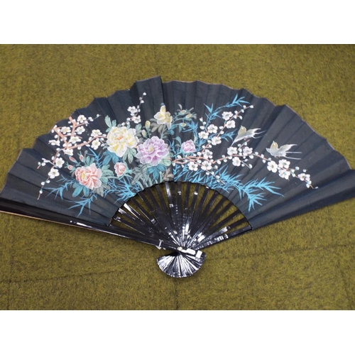 108 - Lovely large oriental silk fan decortated with flowers, ebonised slats. 26 inches wide