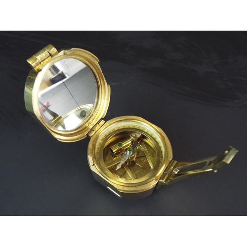 110 - Brass marching compass with spirit leveler to base by Stanley of London.