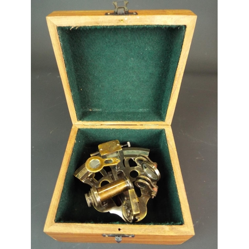 129 - Reproduction brass sextant in purpose built wooden box. Stamped Kelvin & Hughes 1917