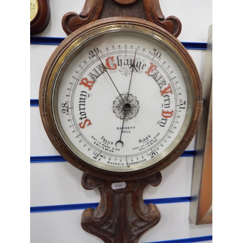 169 - Lovely old Aneroid barometer by Barnet of Hull on carved oak frame. Measuring  33 inches long