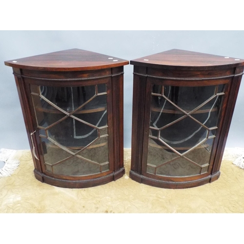 181 - Pair of Mahogany bow fronted wall corner cabinets with glazed panel doors. Each 34 inches tall 20 in... 