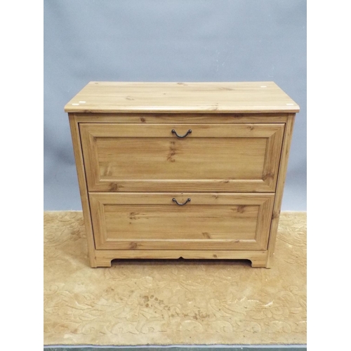 188 - Two drawer chest in light wood print. Hidden drawer within H:32X W:34 X D:17 inches. On castors for ... 