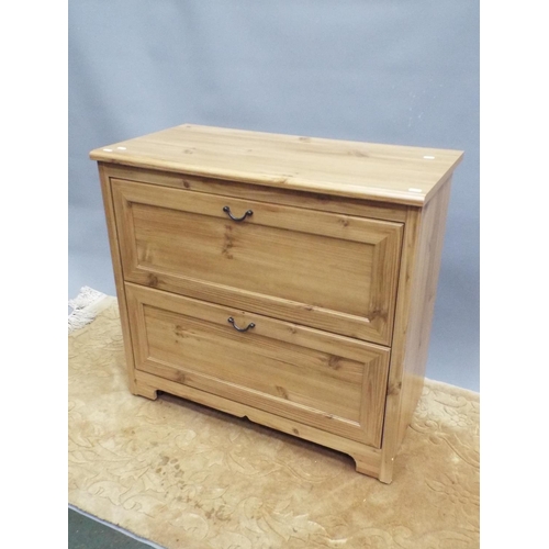 188 - Two drawer chest in light wood print. Hidden drawer within H:32X W:34 X D:17 inches. On castors for ... 