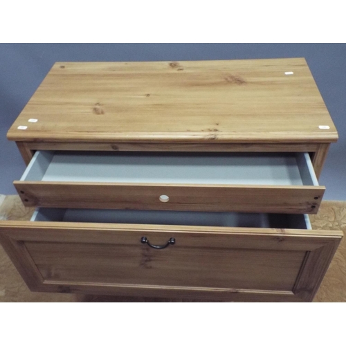 188 - Two drawer chest in light wood print. Hidden drawer within H:32X W:34 X D:17 inches. On castors for ... 