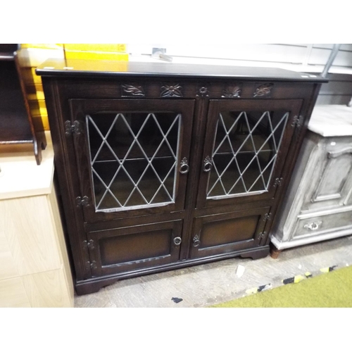 201 - Dark wood old charm style display dresser. Two leaded glass doors with drawers under. H:39 x W:41 x ... 