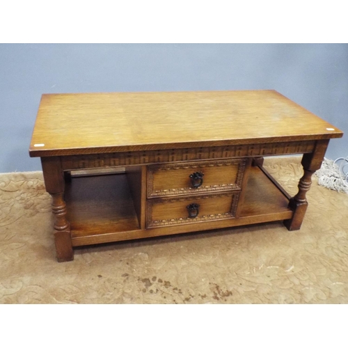 210 - Light oak low table/cupboard with two central doors and bookspace on either side. H:18 XW:40 X D:19 ... 