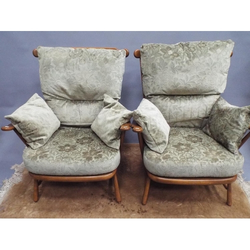 216 - Pair of beautifully made stick back Ercol Chairs in the 19140 pattern. With fitted upholstered cushi... 