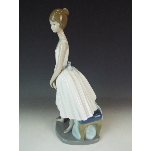 233 - Nao Standing ballerina with stool. 12 inches tall in perfect condition