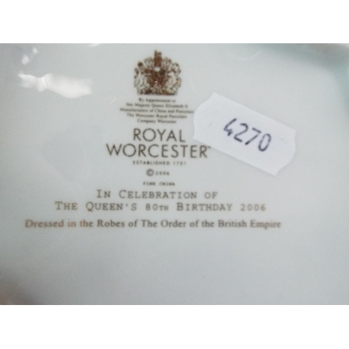 239 - Royal Worcester figurine of HM QE2. Dressed in the robes of the Order of the British Empire. 9.5 inc... 