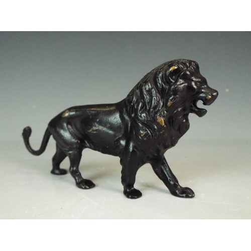 353 - Solid Bronze figure of an African Lion. 5 inches long.