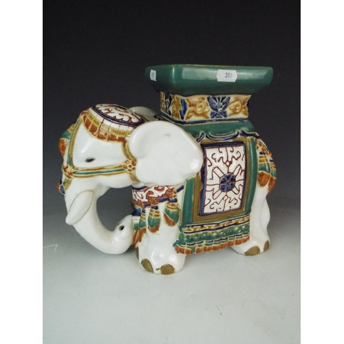 359 - Ceramic plant stand as a decorated Indian Elephant. Approx 11 inches tall.