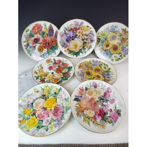 432 - Seven German made Floral decorative plates. Each measures 10 inches in diameter