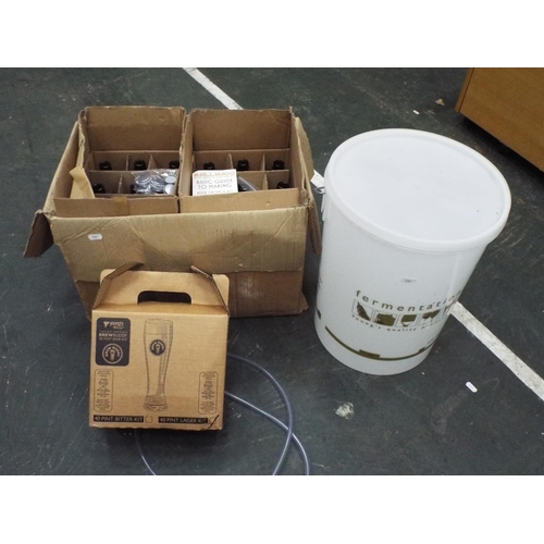 594 - As new beer brewing kit. 24 empty bottles fermentation bucket plus 40 pint beer making kit.