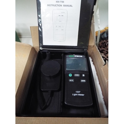 604 - Digital light meter in box.