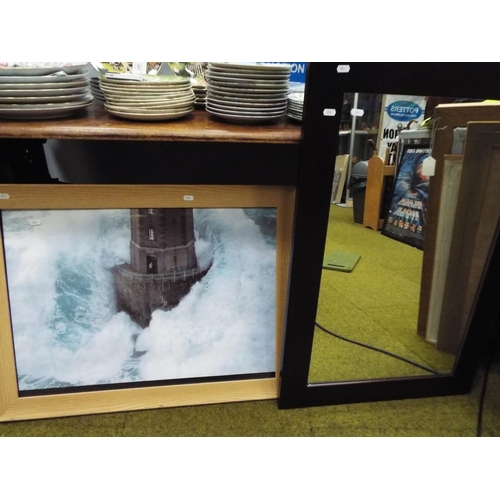 656 - Framed and mounted photo of a lighthouse in stormy sea plus framed mirror