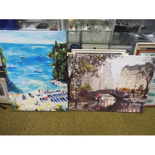 665 - Two oilised prints on canvas, one of a beach scene one of a City bridge. both measure approx 24 x 31... 