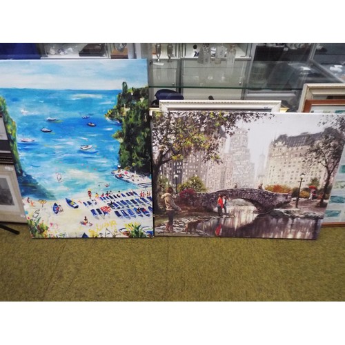 665 - Two oilised prints on canvas, one of a beach scene one of a City bridge. both measure approx 24 x 31... 