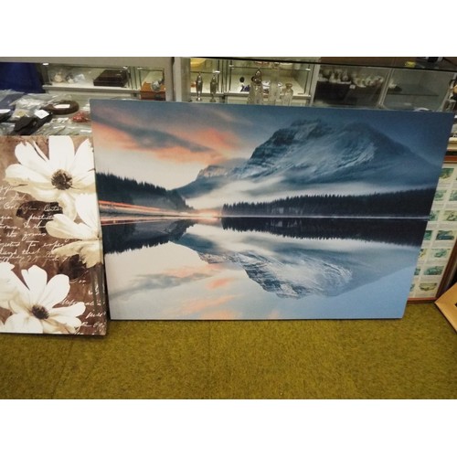 666 - Large print on canvas of a polar scene. measures 32 x 46.5 inches plus one smaller print of flowers