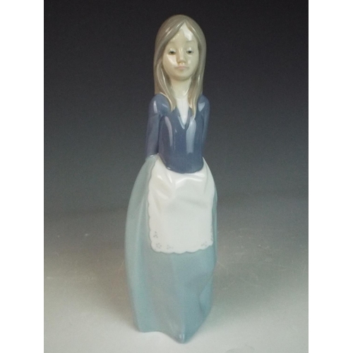 1 - Nao figurine of a young girl. 9 inches tall.