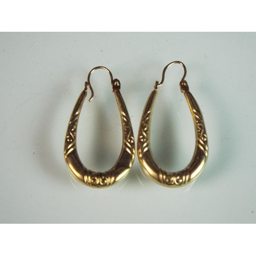 105 - Pair of Drop hoop 9ct yellow gold earrings.  1.1g overal.