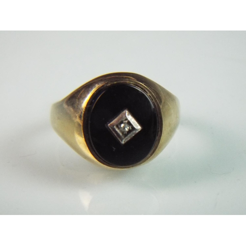 112 - 9ct gold signet ring , Black Onyx face set with a single Diamond.    'O-5'   2.6g