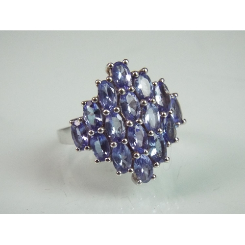 119 - 925 silver ring set with multi Tanzanites. With certificate. Finger size 'O'