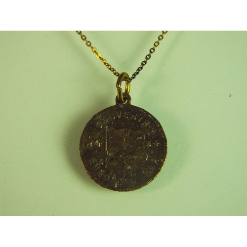 130 - WW1 commemorative medallion set on a yellow metal chain.