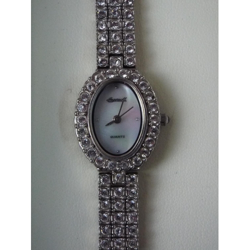 164 - Quartz movement, ladies cocktail watch encrusted with Diamante stones. Requires battery. Elegant woo... 