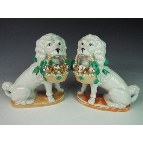 17 - Pair of early 20th Century German made ceramic spaniels, (one with hairlines)