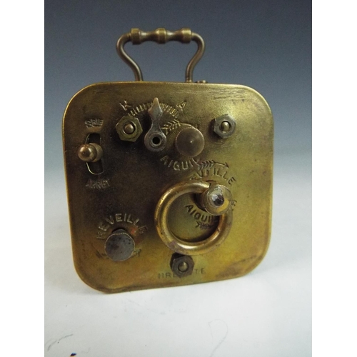 176 - French made brass clock mechanism with enamel face. Requires attention to run.