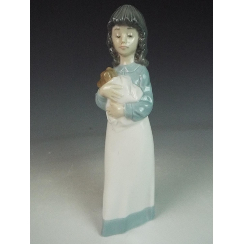 2 - Nao figurine of a girl holding a puppy in a blanket . 9 inches tall.