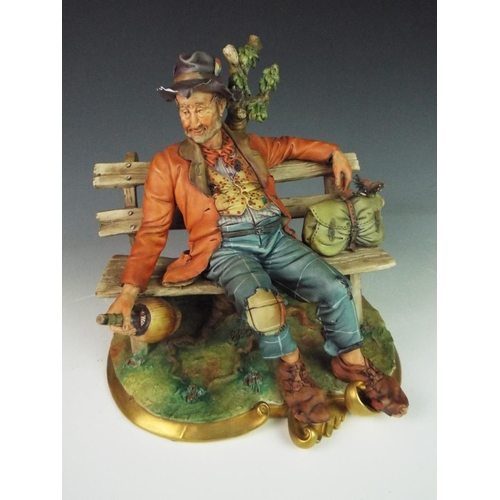 24 - Highly detailed Capo Di Monte model of a tramp on a park bench.  10 inches long, Marked to base.