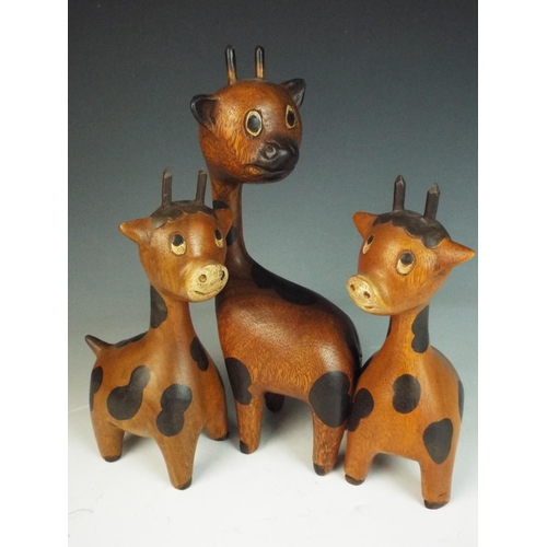 38 - Family of 1970's era wooden giraffes. Tallest 11 inches tall.