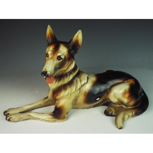 41 - large vintage laying down model of an Alsation dog. 17 inches long. Age worn condition