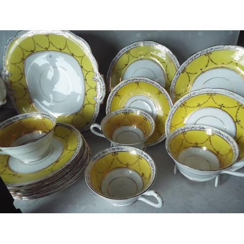 59 - Pretty , early 20th Century Grosvenor china tea set by Jackson-Gosling ltd. 35 pieces.
Hairline to t... 