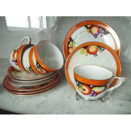 60 - Four Noritake lustre trio's with autumn fruits motif