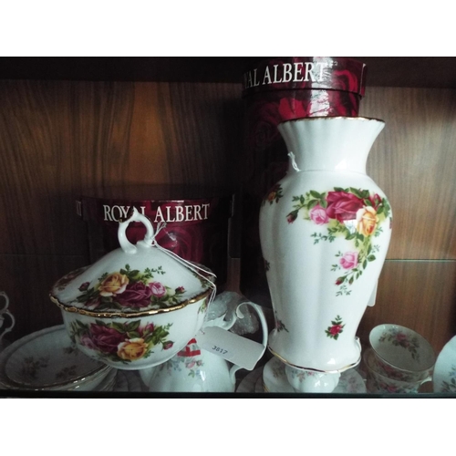 64 - Royal Albert vase and powder jar, both in the Old Country Roses pattern. Complete with original boxe... 