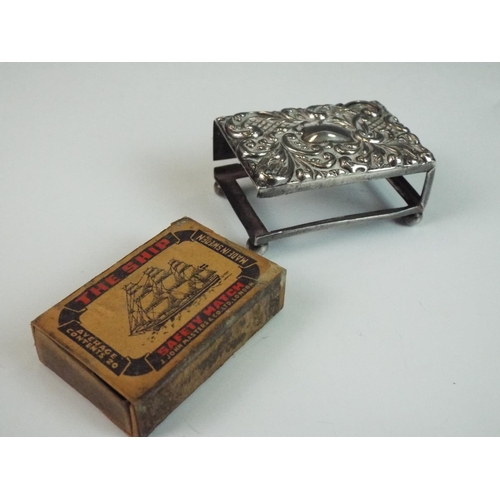 191 - Small silver matchbox holder with repousse decoration to lid. Some repairs needed. 45mm long. Birmin... 