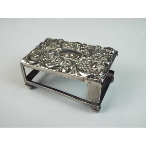 191 - Small silver matchbox holder with repousse decoration to lid. Some repairs needed. 45mm long. Birmin... 