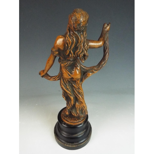 203 - Heavy Spelter figurine of a classical figure raised on a turned ebonised base. 12 inches tall. TOC e... 