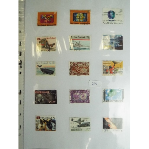 225 - Well presented albums of stamps from Canada and New Zealand. Some mint.